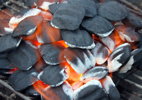 burning charcoal briquettes